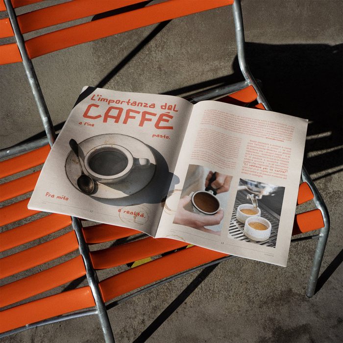 F.U.C.K. Magazine aperto su una sedia arancione, alla pagina sul caffè